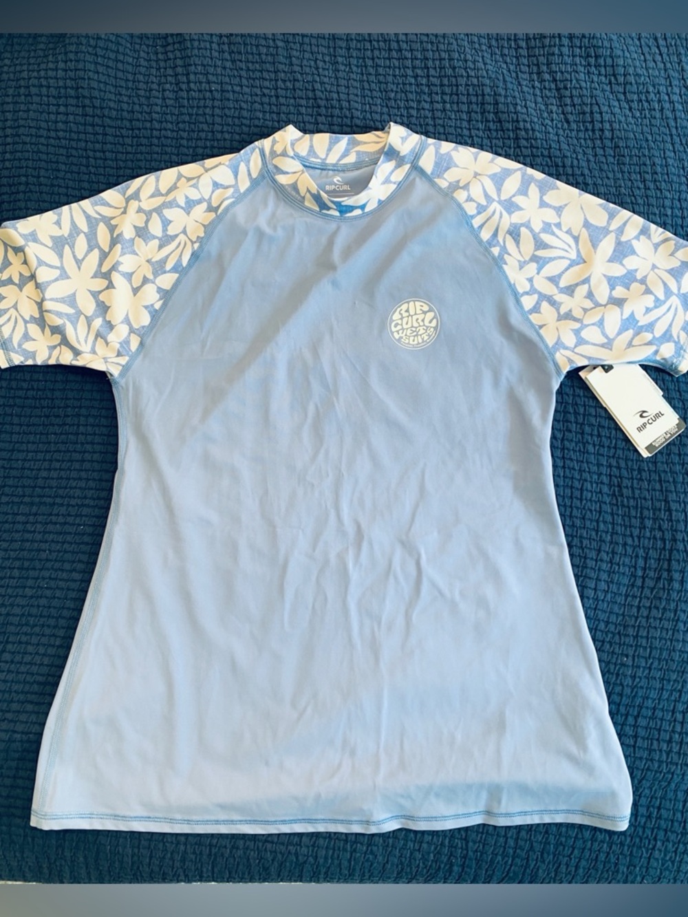 Rip Curl Light Blue short sleeve Rash Guard with White Floral Sleeves